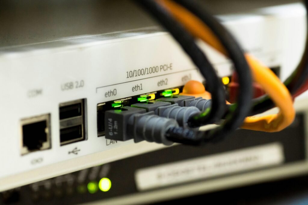 network cable ethernet computer 159304 159304 Detailed close-up of ethernet cables and network connections on a router, showcasing modern technology.