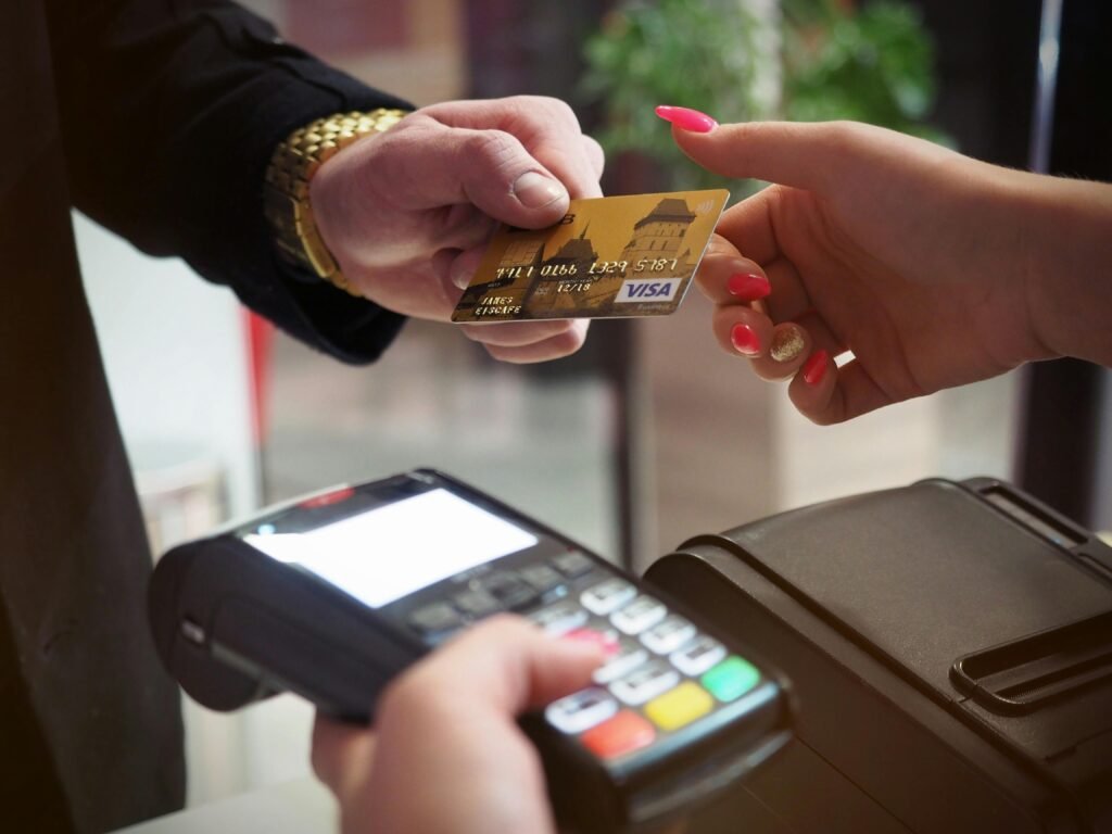 pexels photo 2988232 2988232 Close-up of a credit card payment being processed at a POS terminal.